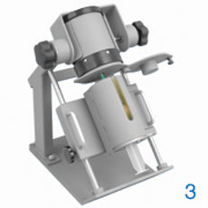 BEXXAR Dose Preparation System Syringe shield slides upward allowing the syringe to puncture the vial septum