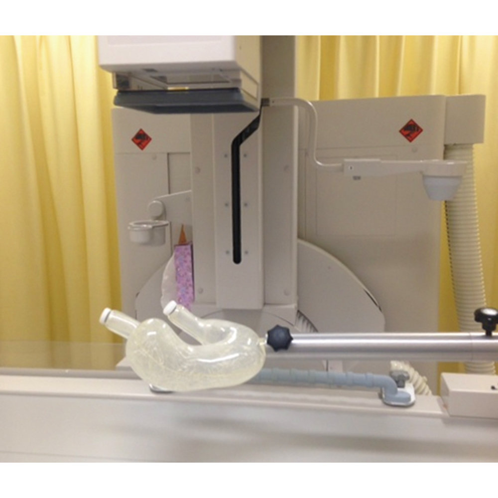 PH-19 stomach phantom positioned on a fluoroscopy table