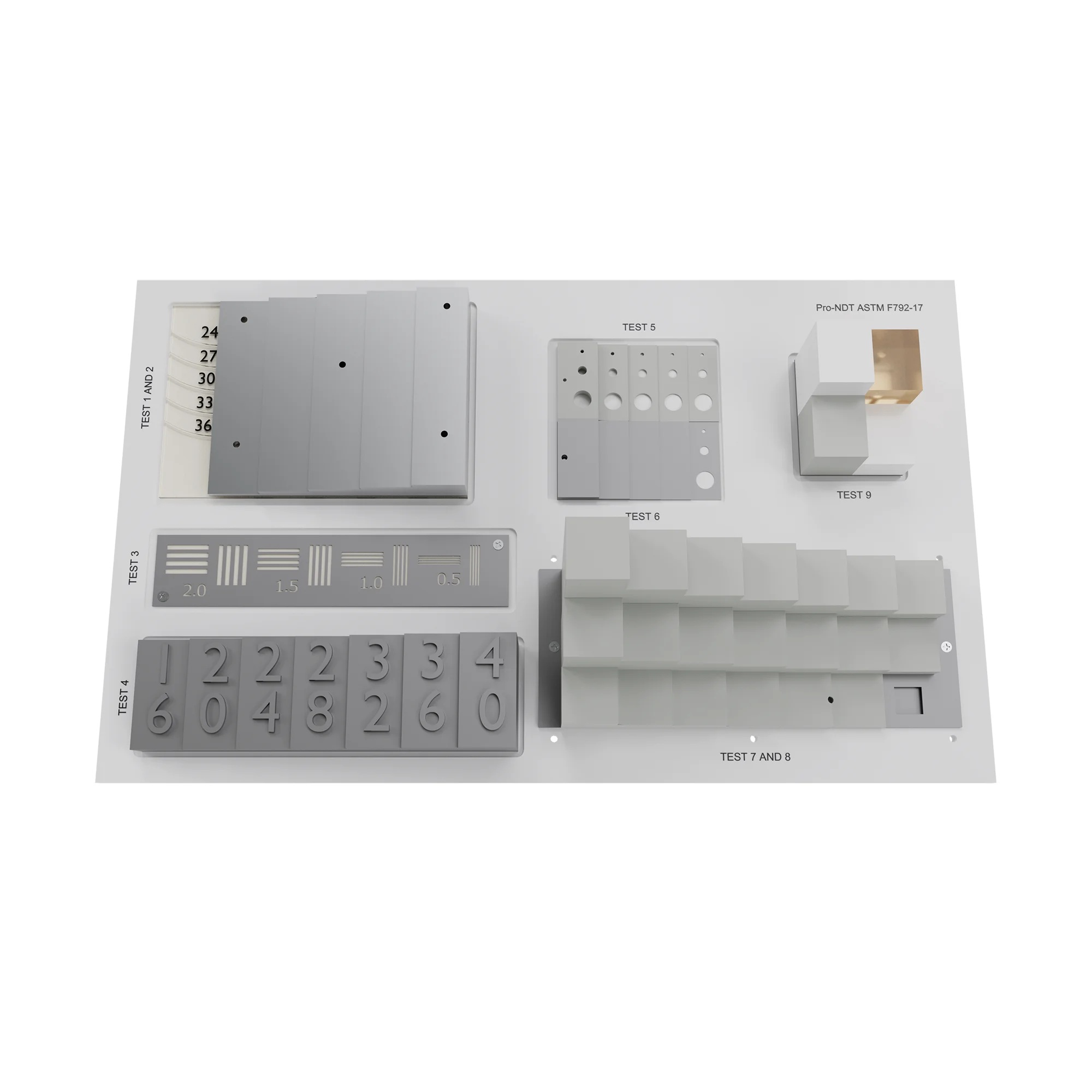 A board with 9 different test objects attached to the top surface. Blocks, step wedges, numbers, holes etc.