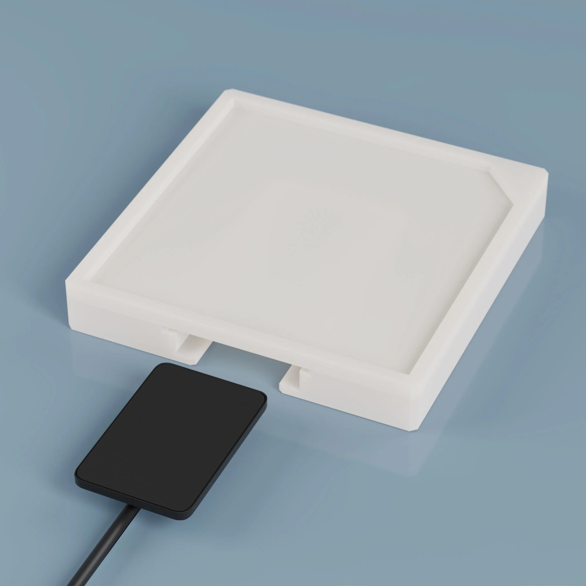 Square, flat plastic element with a hole for a x-ray film or sensor