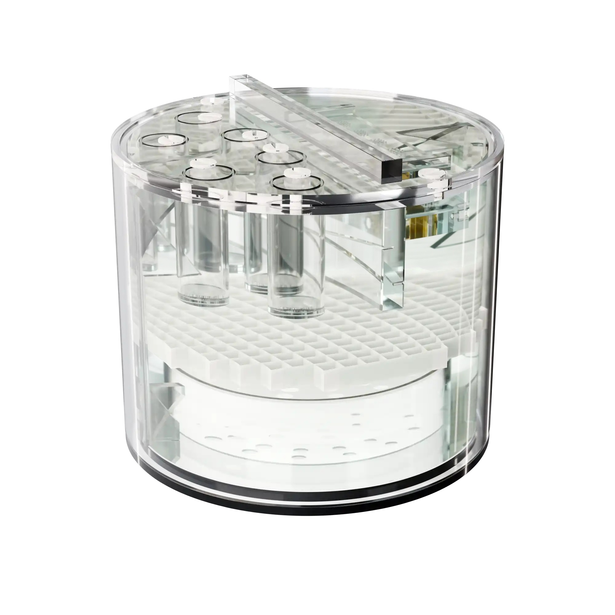 A transparent acrylic cylinder with multiple test shapes inside and filled with greenish fluid.
