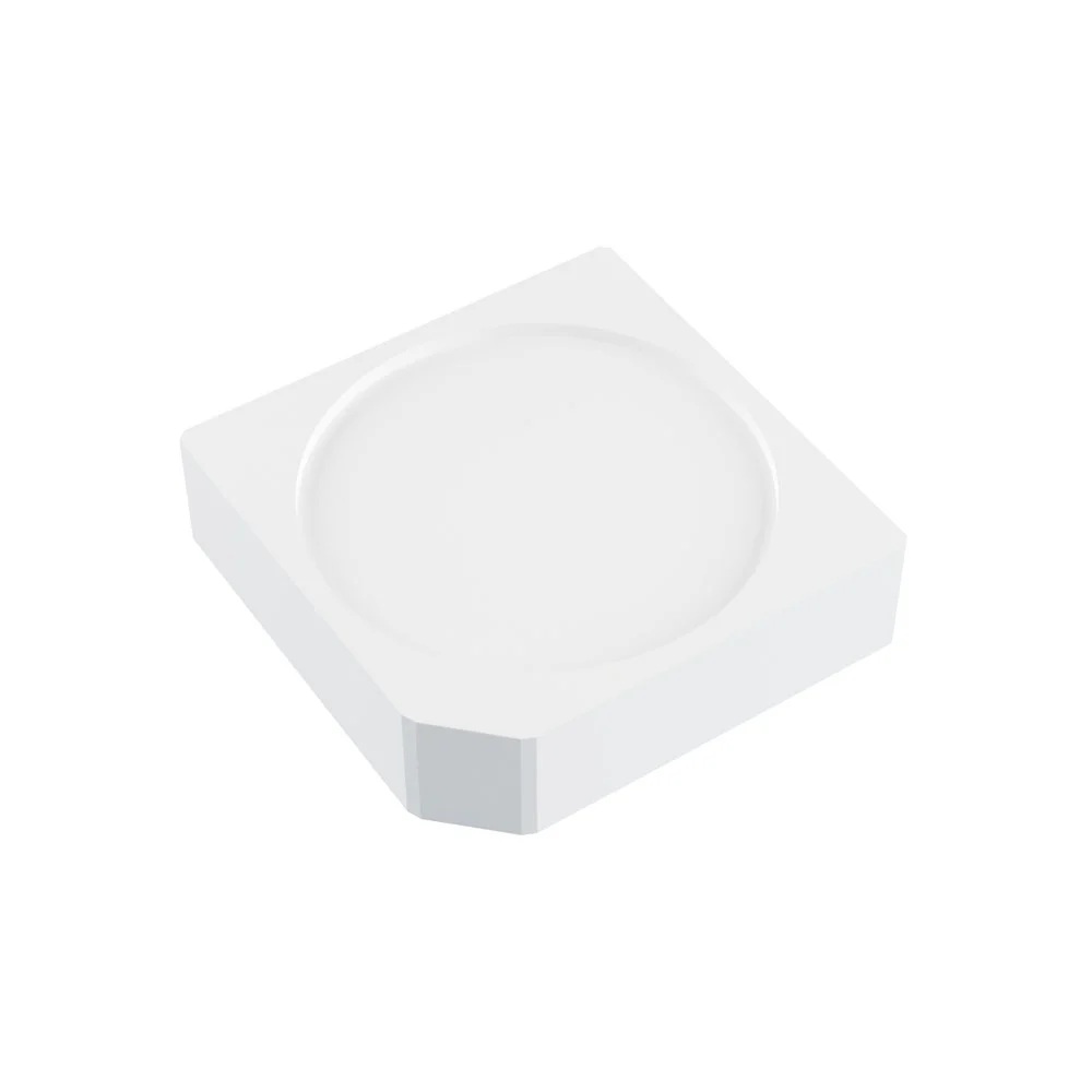 A square, thick plastic device with a circle engraved in the centre and one bevelled edge.