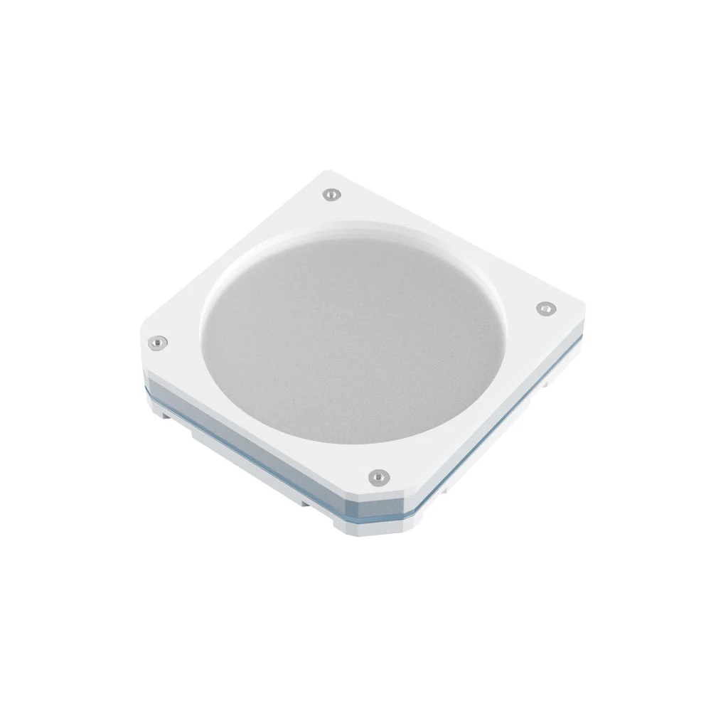A square device made of four layers of plastic and metal, with a circle engraved on top and two bevelled edges.