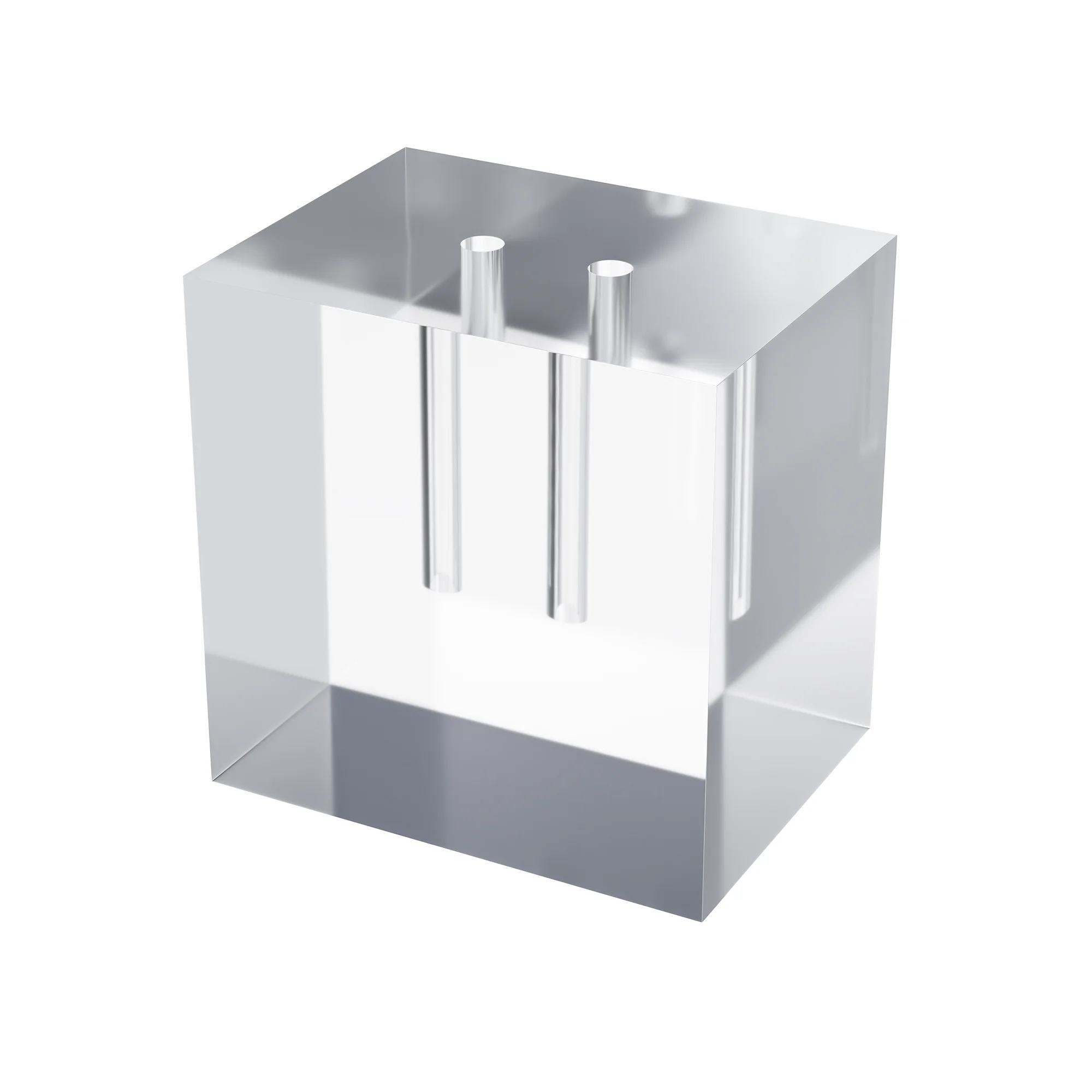 A transparent PMMA block with two deep holes.